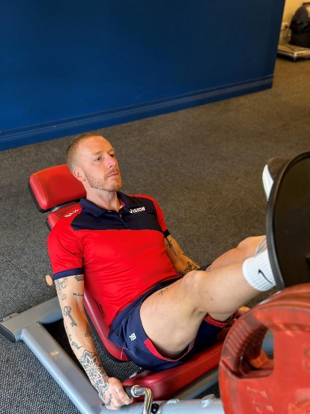 a Vision PT personal trainer using the leg press machine