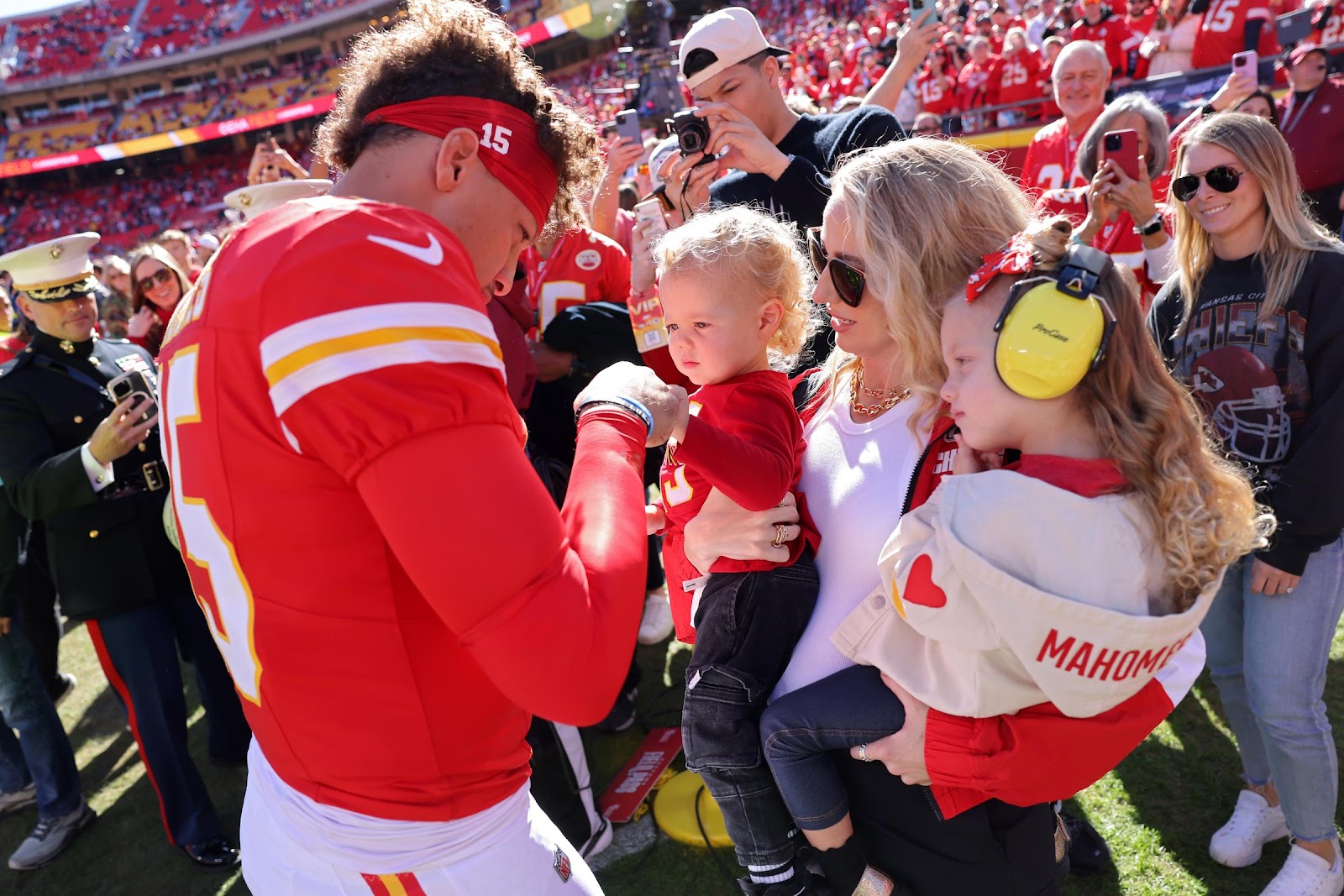 Patrick Mahomes fist bumps his son, Bronze, while his wife and daughter, Brittany and Sterling, watch prior to a game against the Denver Broncos on November 10, 2024, in Kansas City, Missouri | Source: Getty Images