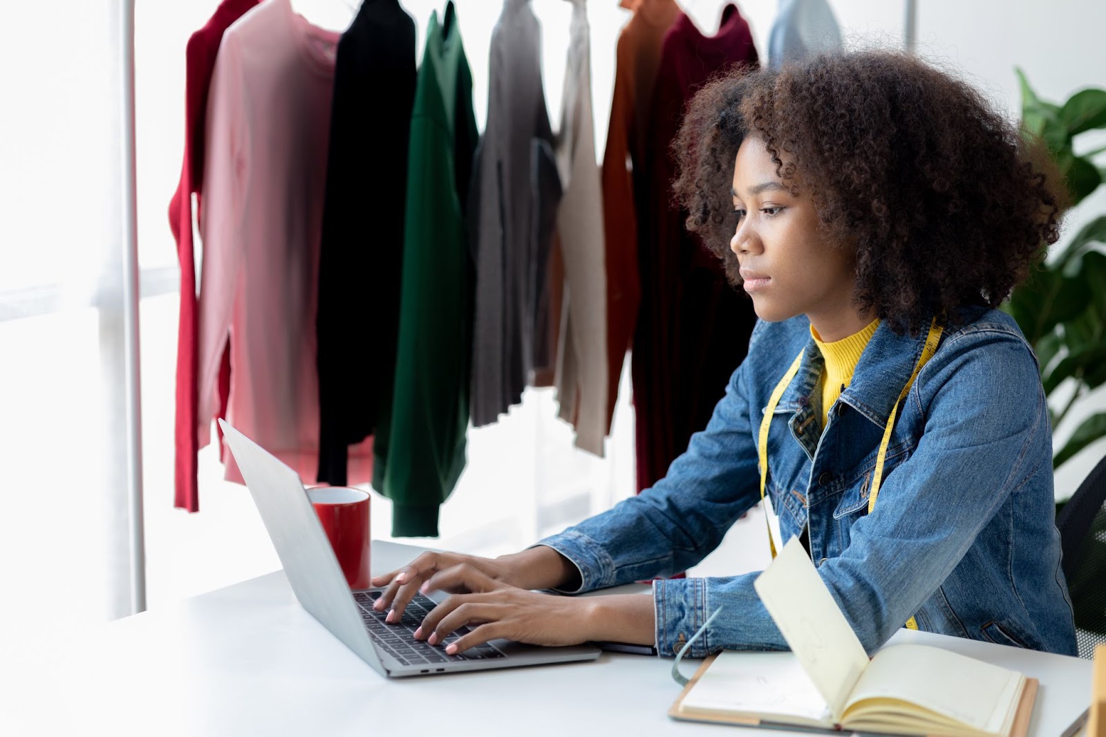 Woman writing fashion data for her clients