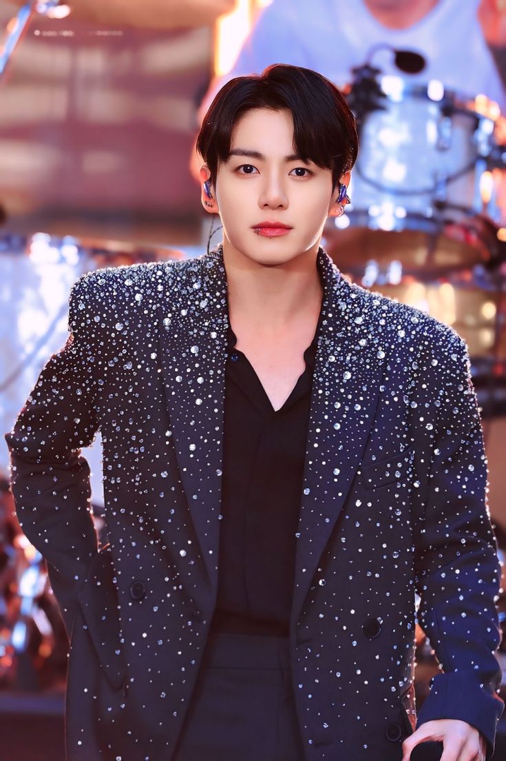 This contains an image of Jungkook