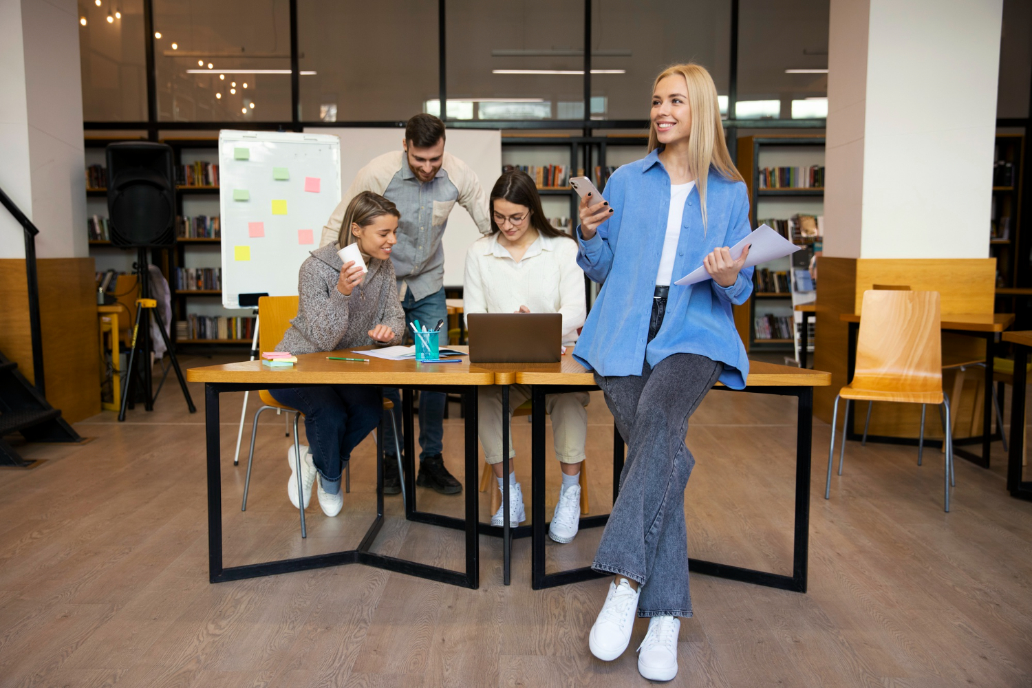 A diverse group of happy and productive colleagues collaborating in a safe and modern office environment.