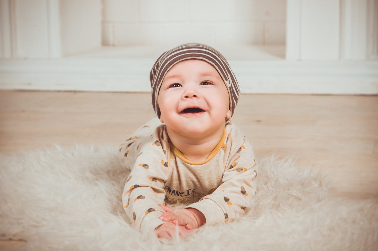 Baby Lying On White Fur Textile // Healthier Baby Today