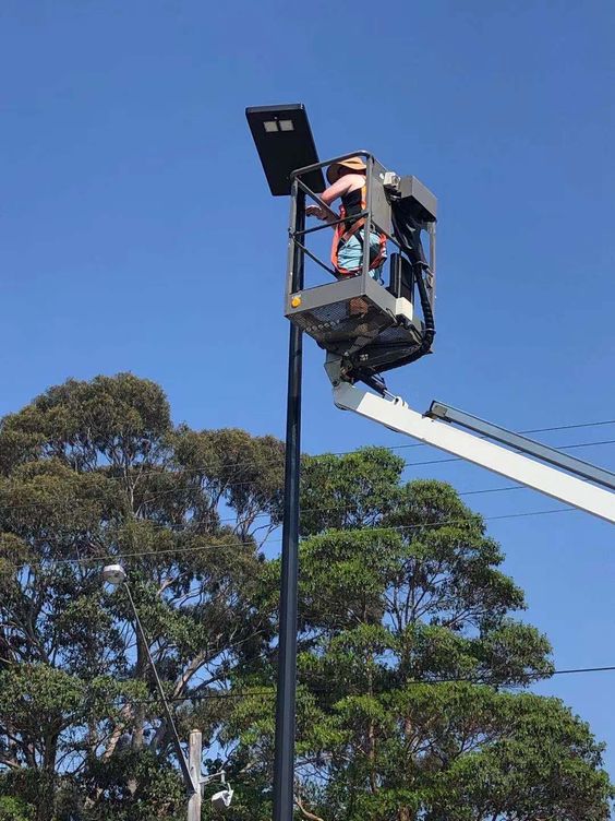 the image displays a solar street light installation