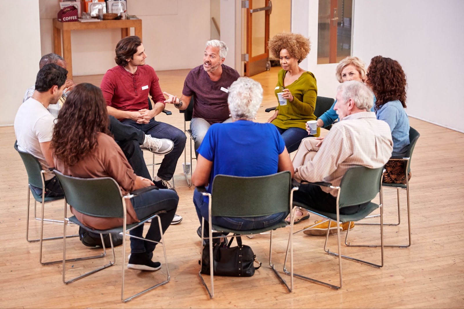 Support group sitting in a circle.