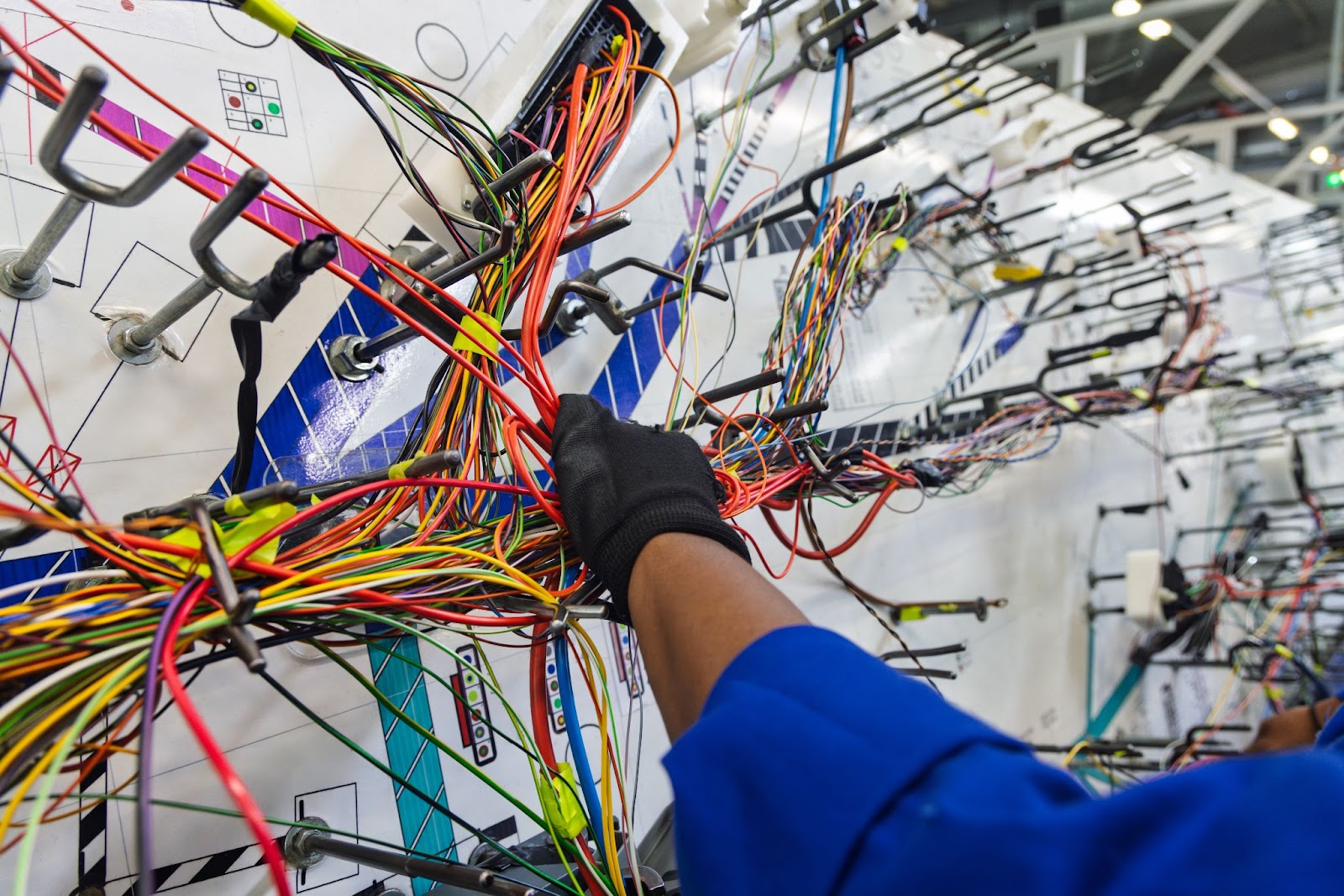 A car’s wiring harness undergoing assembly