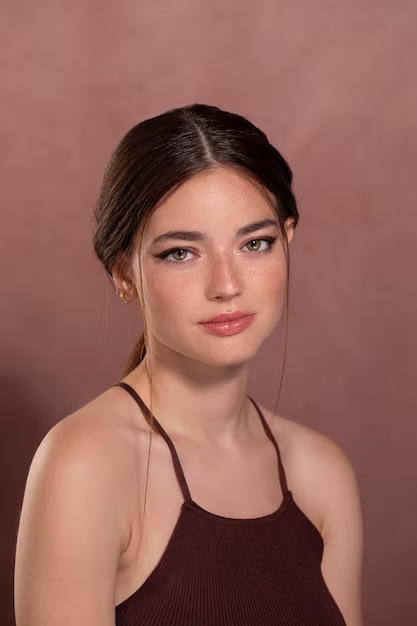 A female model headshot in simple clothes