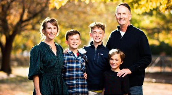A family posing for a picture
