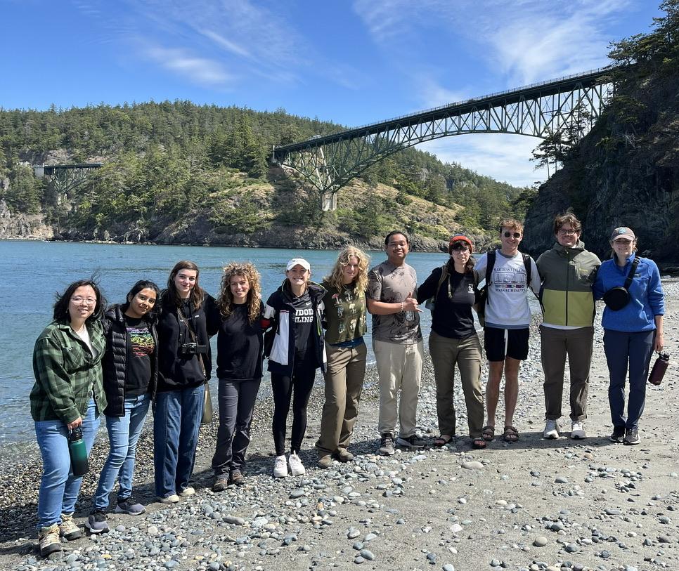 A group of people posing for a photo

Description automatically generated