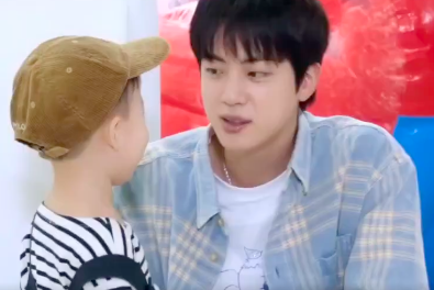 This contains an image of BTS Jin and three-year-old Taeha on the  latest episode of "Run Jin" 