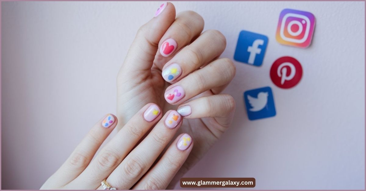 Hand with pastel nail art, social media icons, titled “Trending Pastel Nail Art On Social Media.