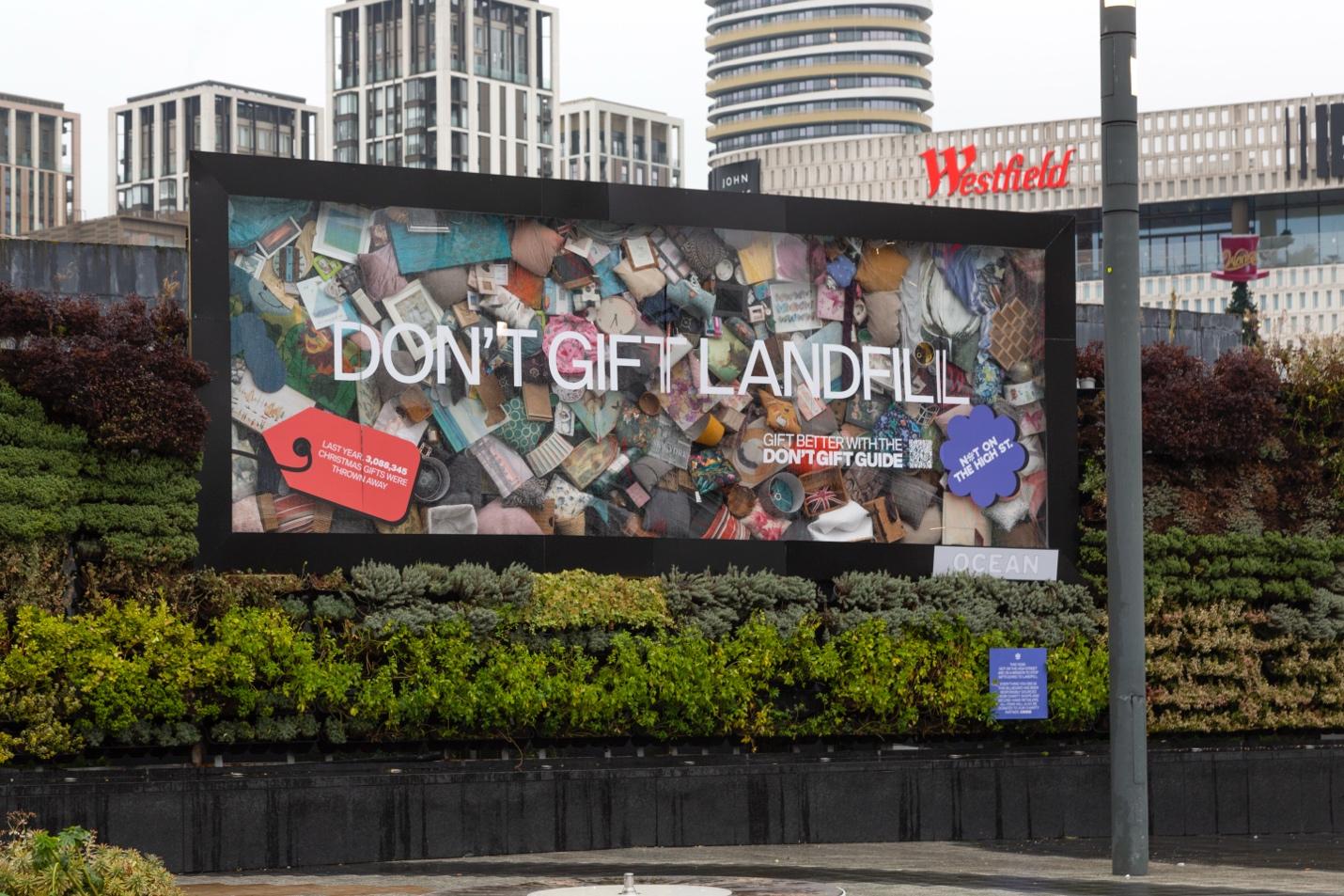 A large billboard with a picture of a bag on it Description automatically generated