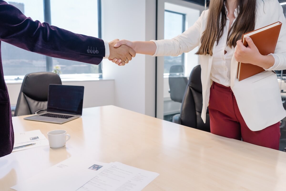 HR manager shaking hands with an applicant