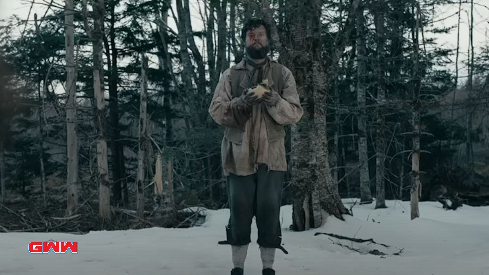 A character standing alone in the woods holding a mysterious object.