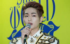 This contain an image of SHINee's Onew 