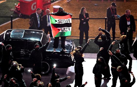 Super Bowl halftime show dancer displays Palestinian, Sudanese flags during  Kendrick Lamar performance