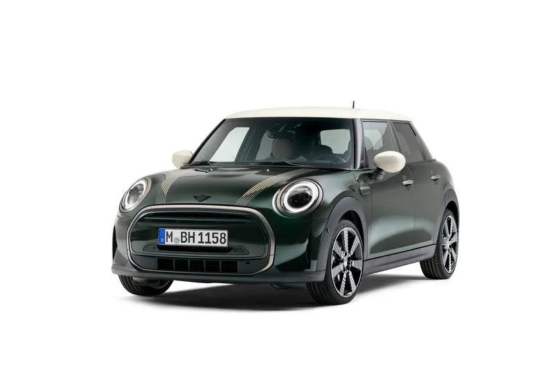 A green car with white accents

Description automatically generated