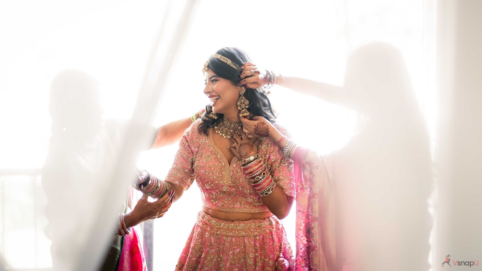 Joyful bride sharing a smile with her family, a timeless moment for wedding photography in 2025