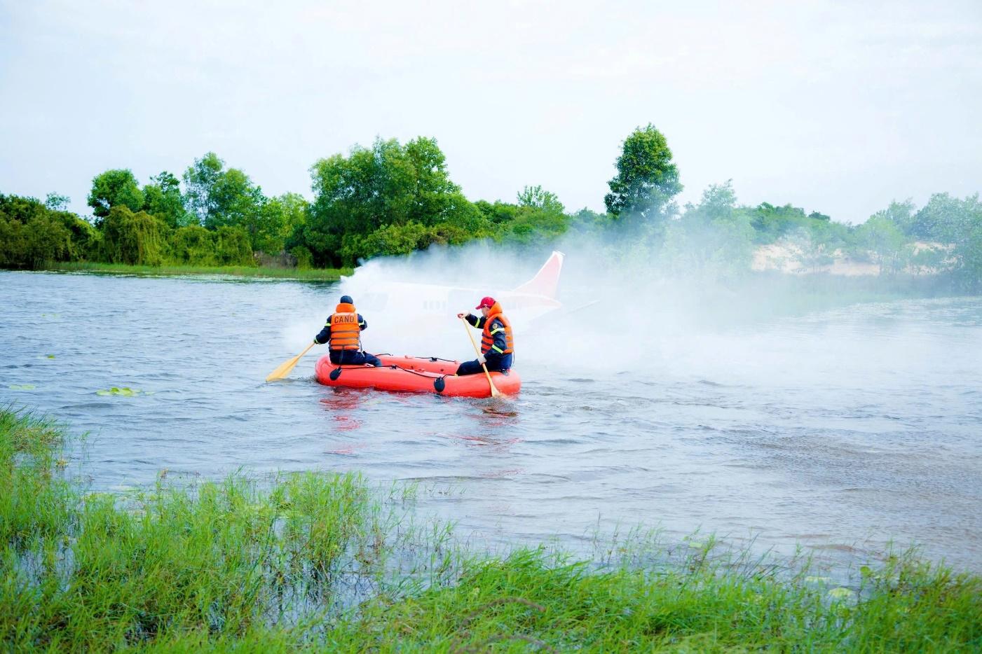 A group of people in a raft on a riverDescription automatically generated