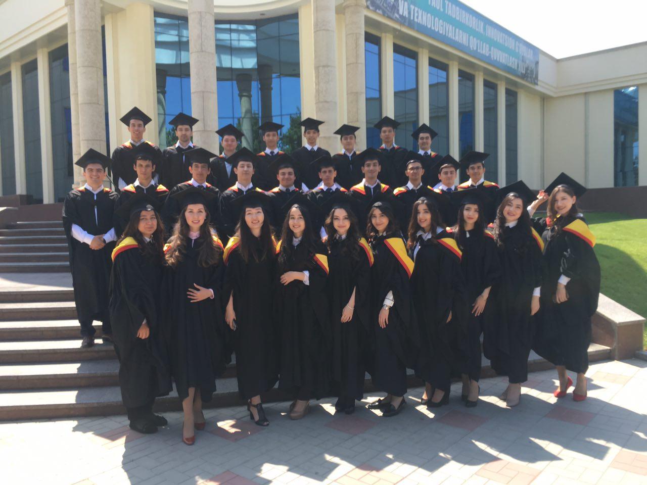 A group of people in graduation gowns and caps

Description automatically generated