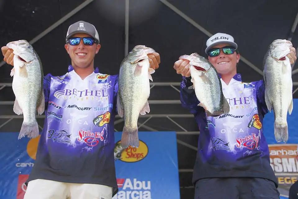Men holding fish and posing for camera

AI-generated content may be incorrect.