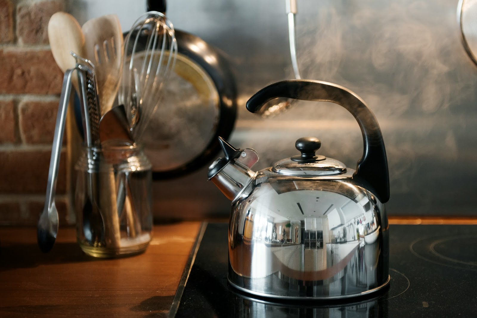 Metal kettle boiling on a hob