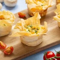 Mini Filo Pastry Quiches on a serving board.