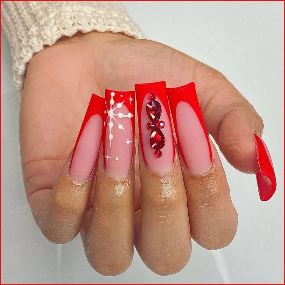 Close up of hands having Christmas red nails with Rhinestone-Studded Christmas Red