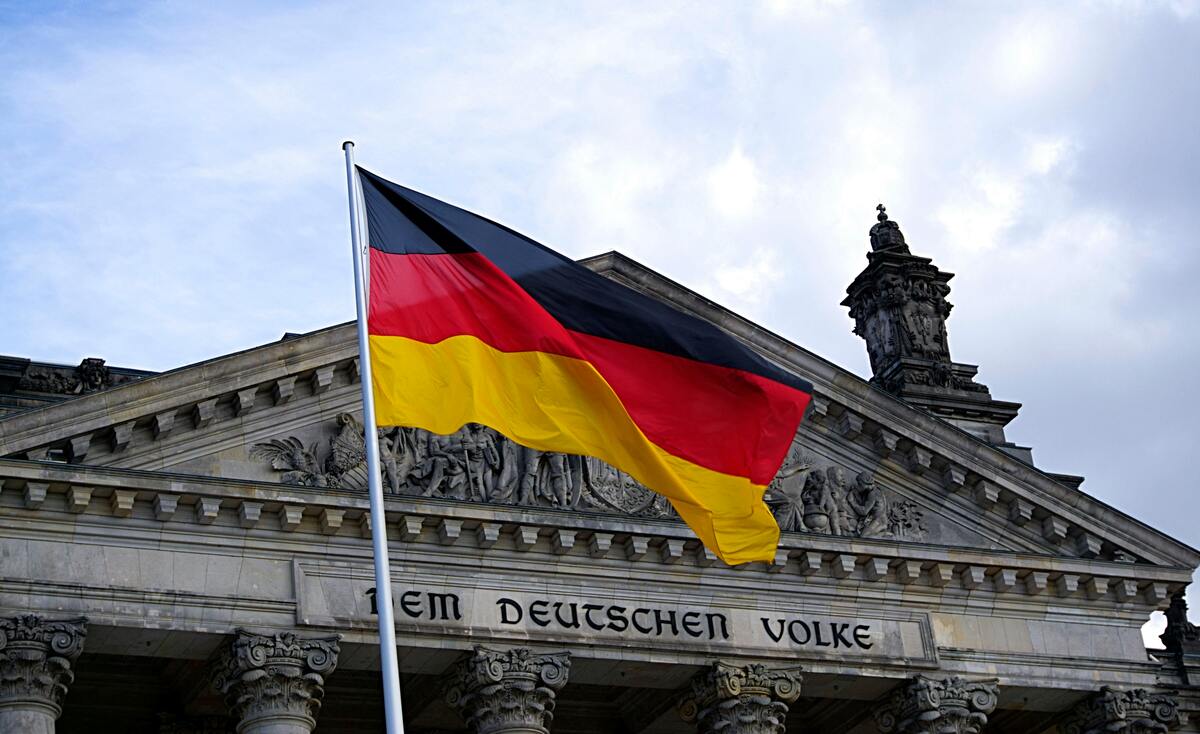 The national flag of German waving on a flagpole, symbolising Germany identity and international shipping destinations.