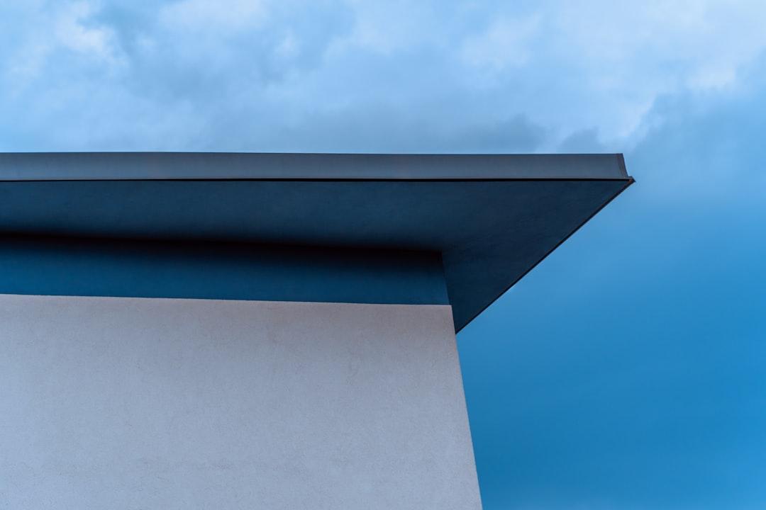 a tall building with a sky in the background