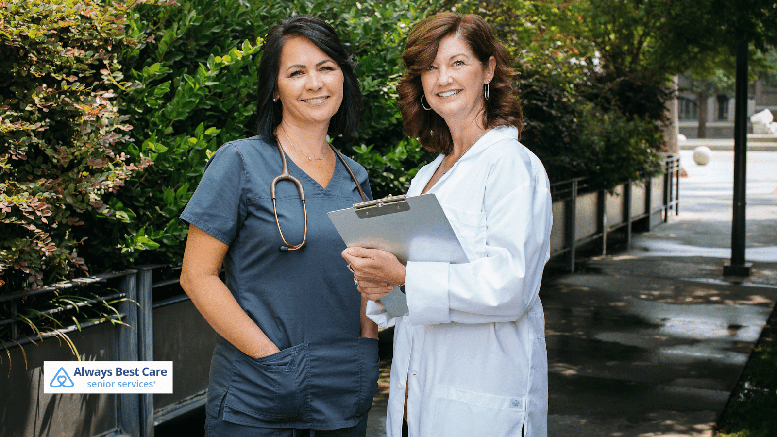 This image depicts a female caregiver and a female physician