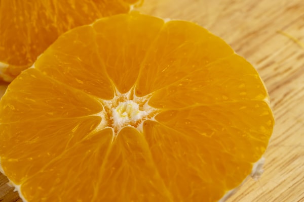 A close-up of a halved orange showing its juicy interior