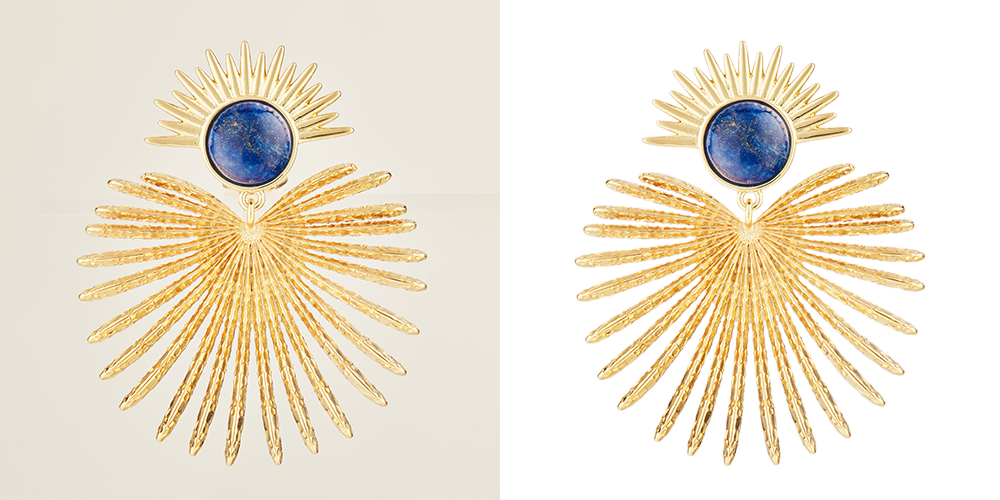 Gold sunburst brooches with blue center stones against a light background.