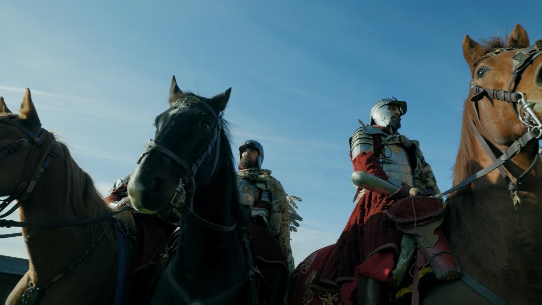 A group of men in armor riding horses

Description automatically generated