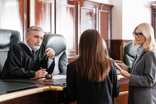 judge speaking to attorneys