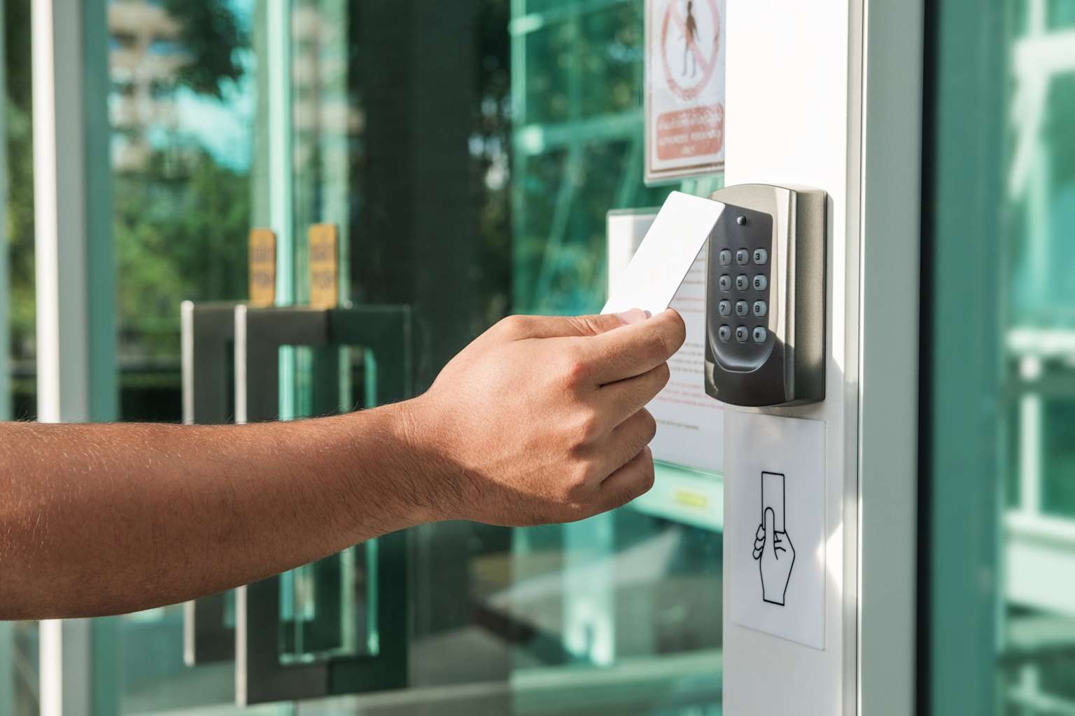 An access control system with a card reader and keypad for secure entry into a building