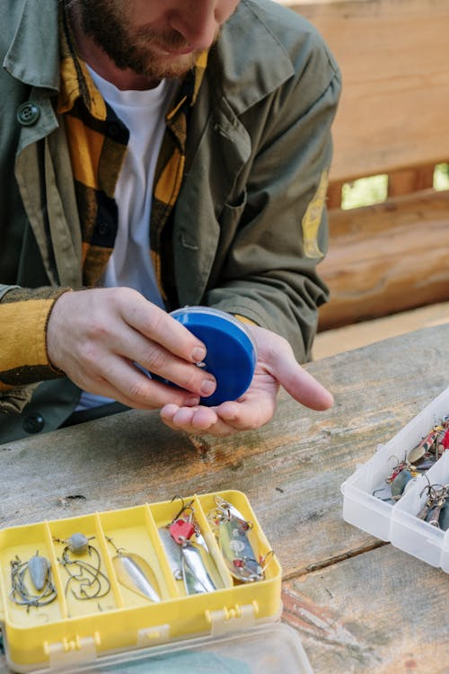 Camping Gear: image of a man storing hooks