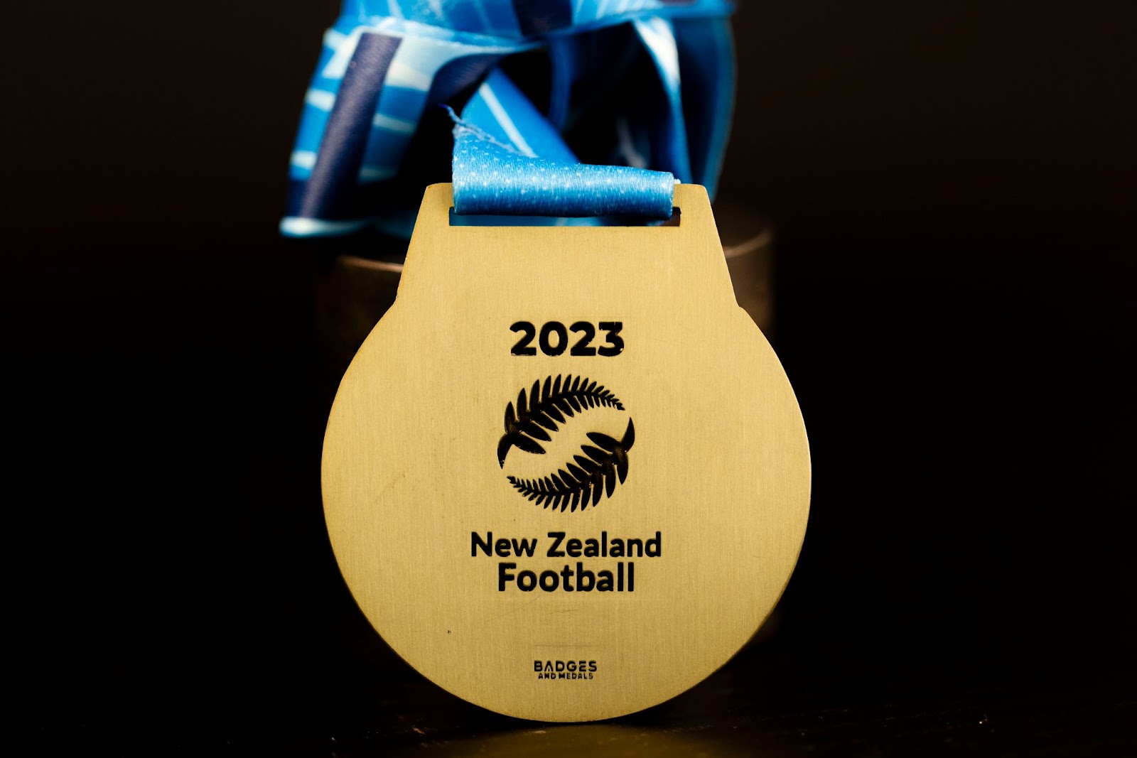 Custom engraved medal for New Zealand Football.