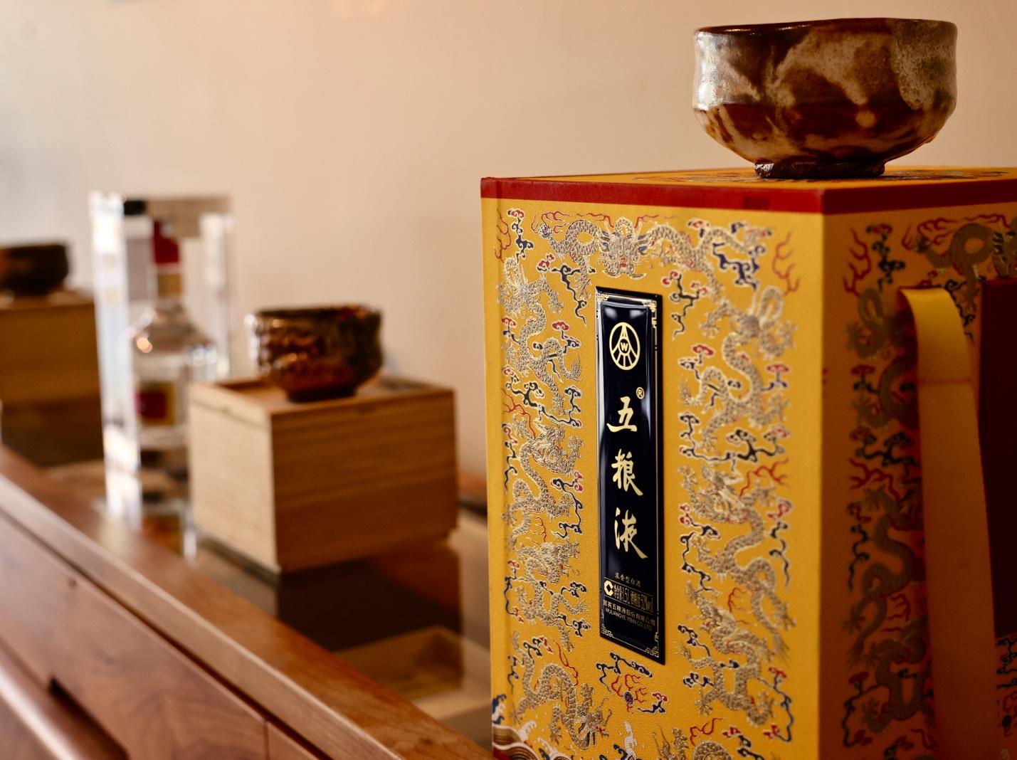 A yellow box with dragon design on top

AI-generated content may be incorrect.