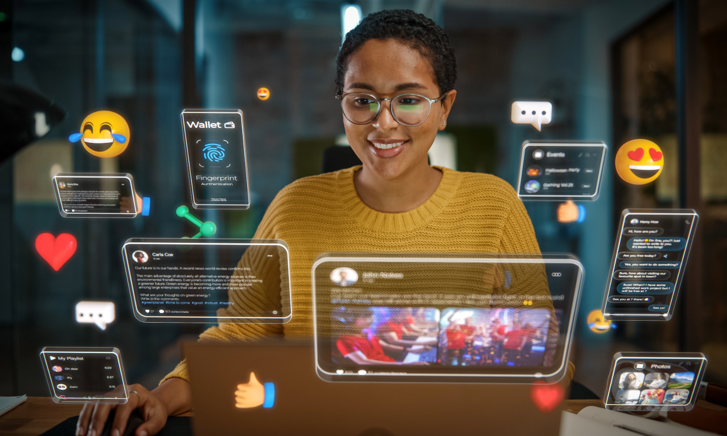 A woman at her desk engages with her laptop, which features multiple social media icons on the screen.