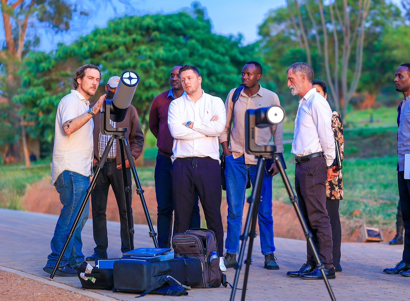 A group with TRL Space RW, TRL Space CZ, and RSA looking at the Sun through the Unistellar EVSCOPE2 and ODYSSEY under the guidance of Dr. Lambert.