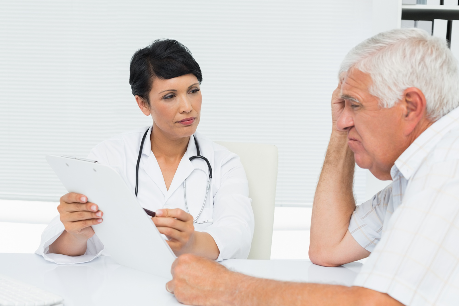 A Doctor explaining medication to a patient.