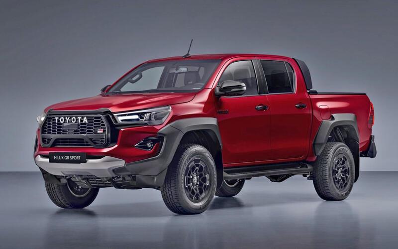 A red truck on a gray background

Description automatically generated