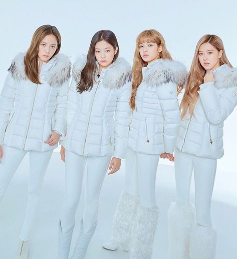 This contain BLACKPINK in white outfits with fur collars and hoods, all standing next to each other