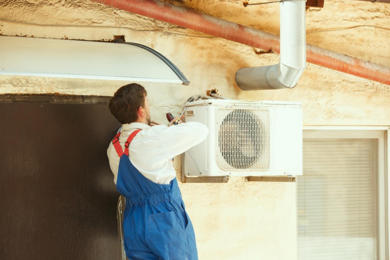 hvac-technician-working-capacitor-part-condensing-unit