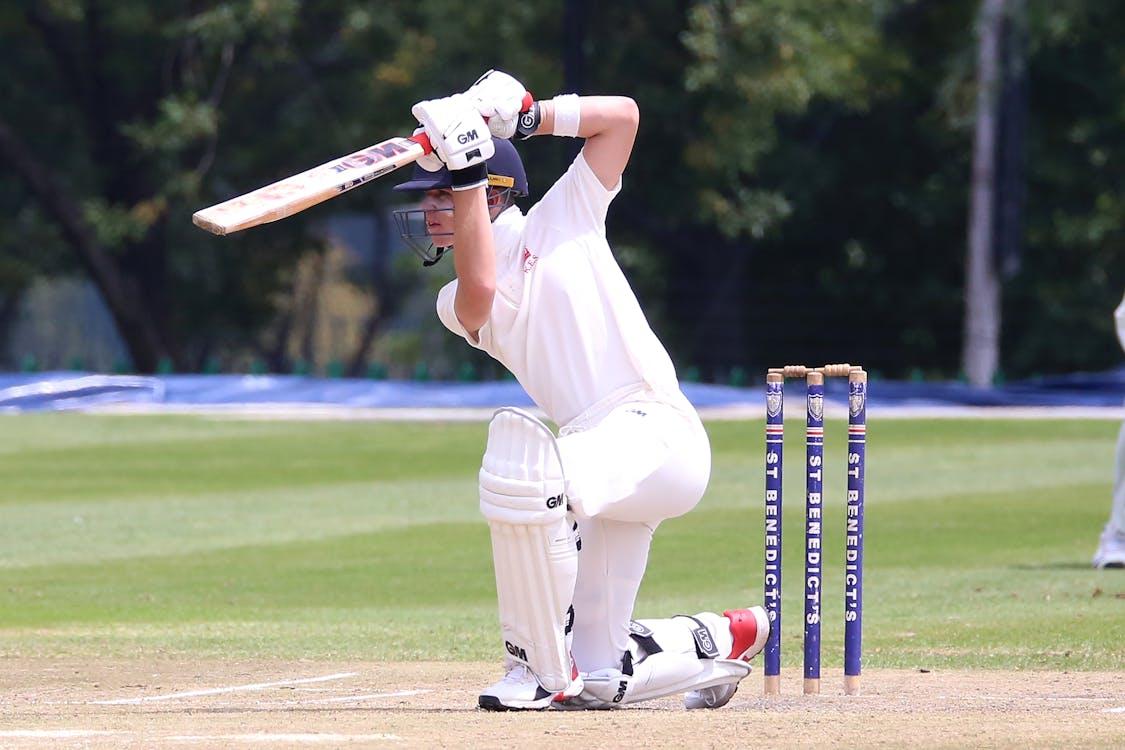 Free Man in White Jersey Shirt and White Pants Playing Cricket Stock Photo