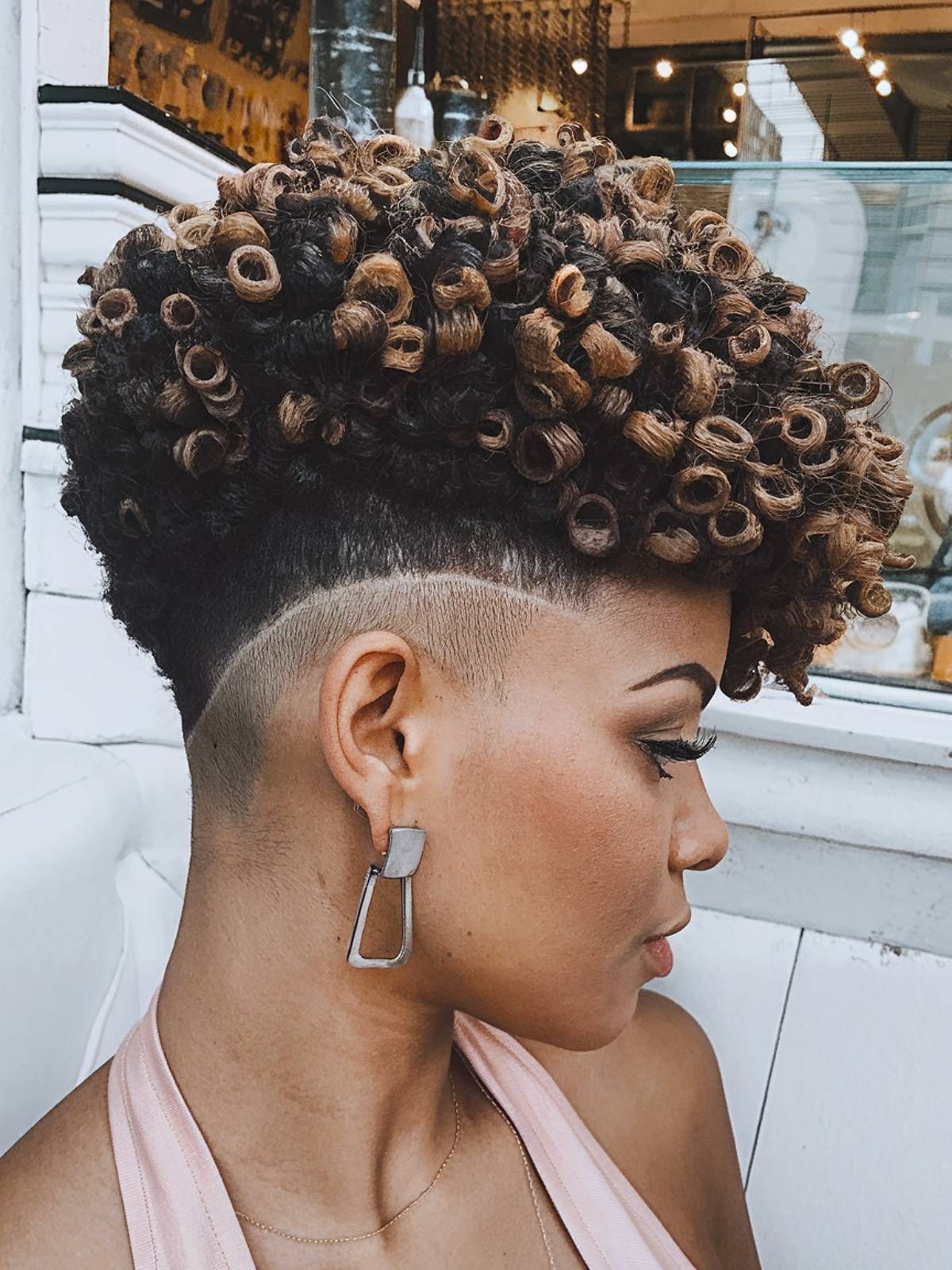 a lady rocking edgy short hair with fade