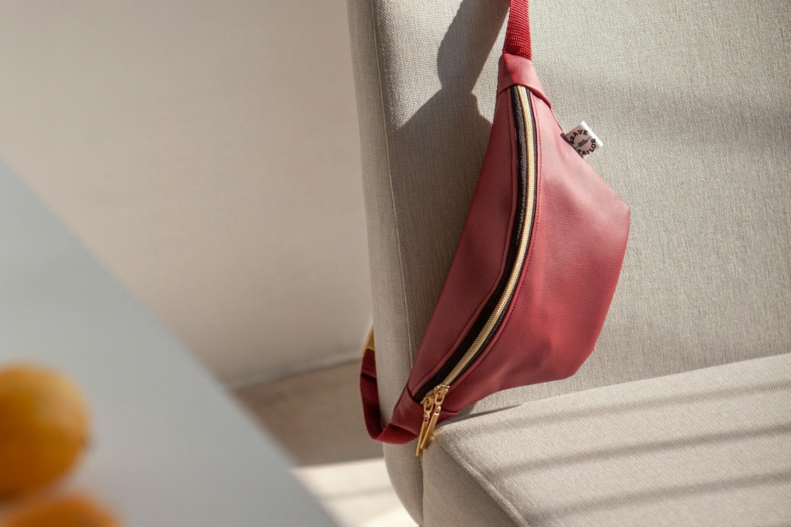 A red fanny pack on a chair