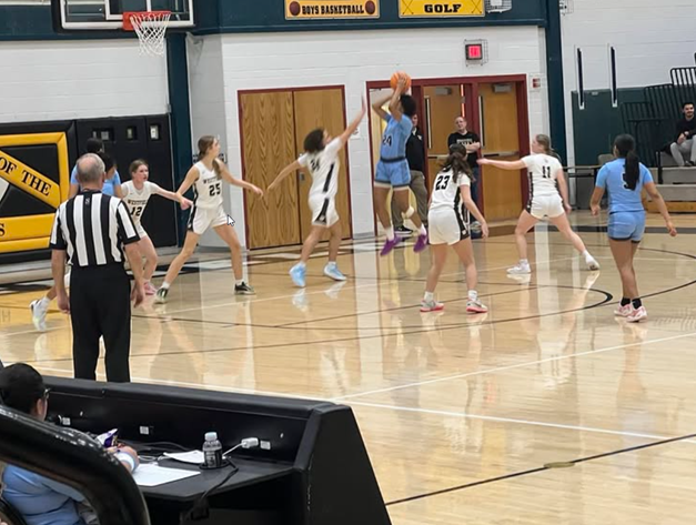 Girls playing a varsity basketball game between Westfield and Centreville high schools. 