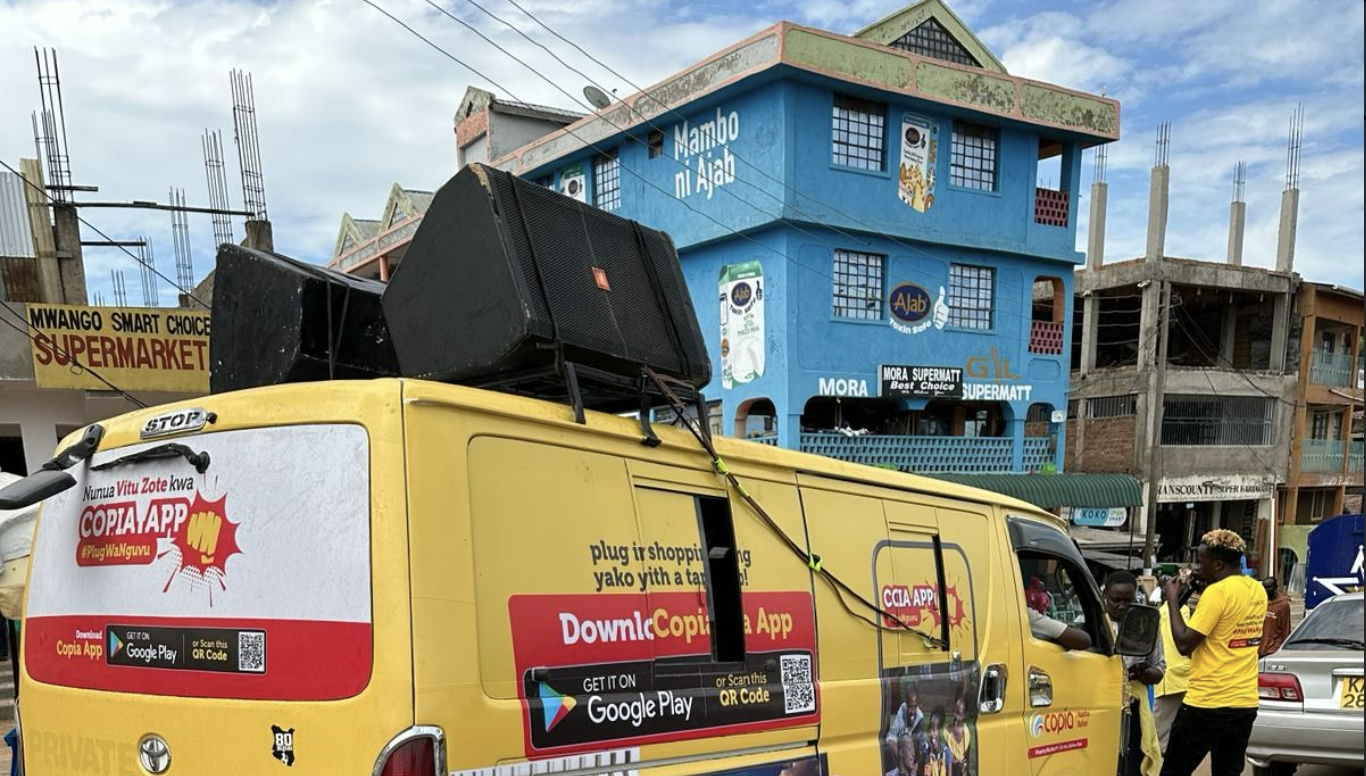 Bus covered Copia posters. Photo by copiakenya via Instagram.