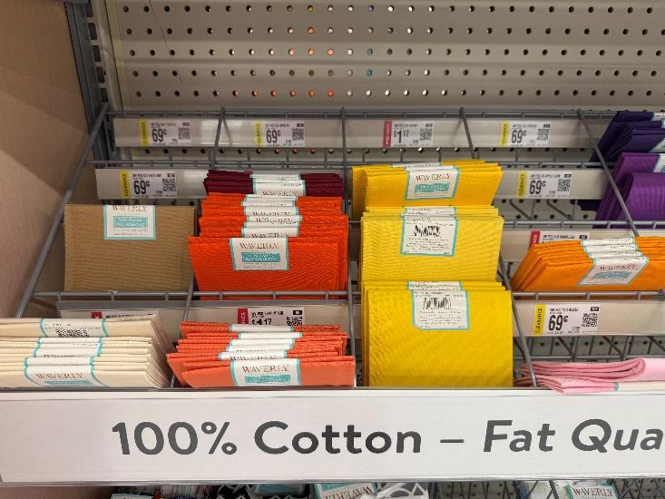 A shelf with colorful fabric on it

AI-generated content may be incorrect.